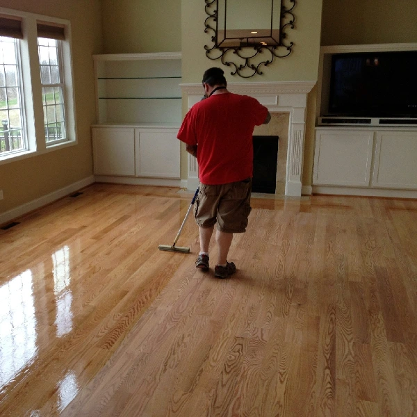high-gloss finish to a natural oak plank living room floor