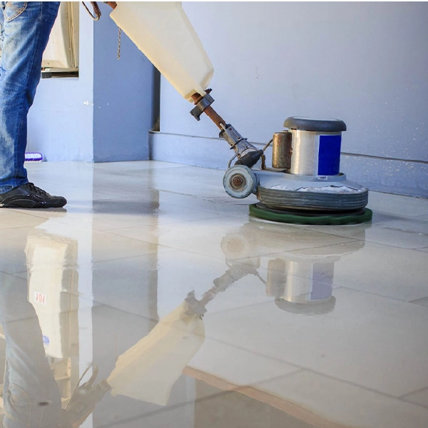 worker using a specialized machine for professional stone floor polishing
